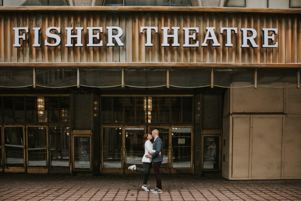 Couple posing in front of the Fisher Building during their Detroit Winter Engagement Session.