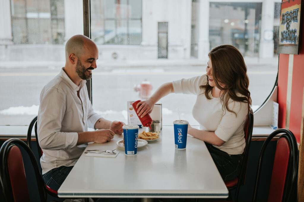 Fun engagement photos at American Coney Island in Detroit.