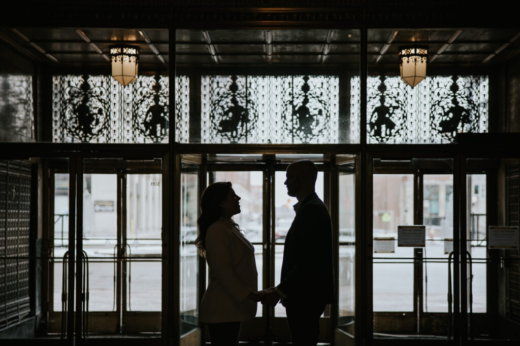 Engagement session at the Fisher Building, highlighting its Art Deco architecture.