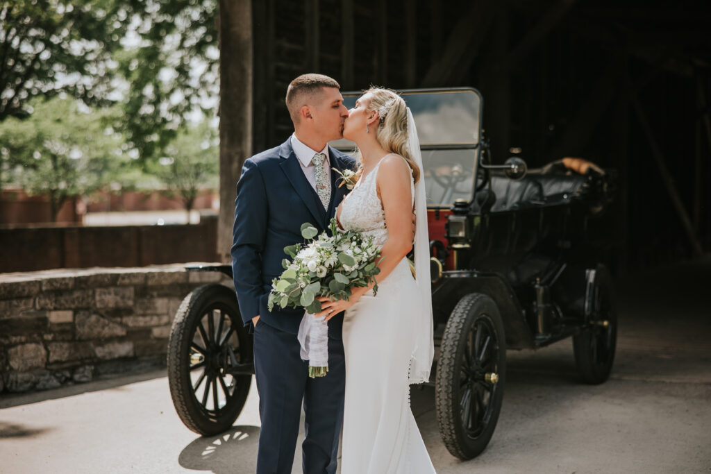 Romantic portrait of newlyweds at Greenfield Village, capturing their love amidst the historic backdrop.