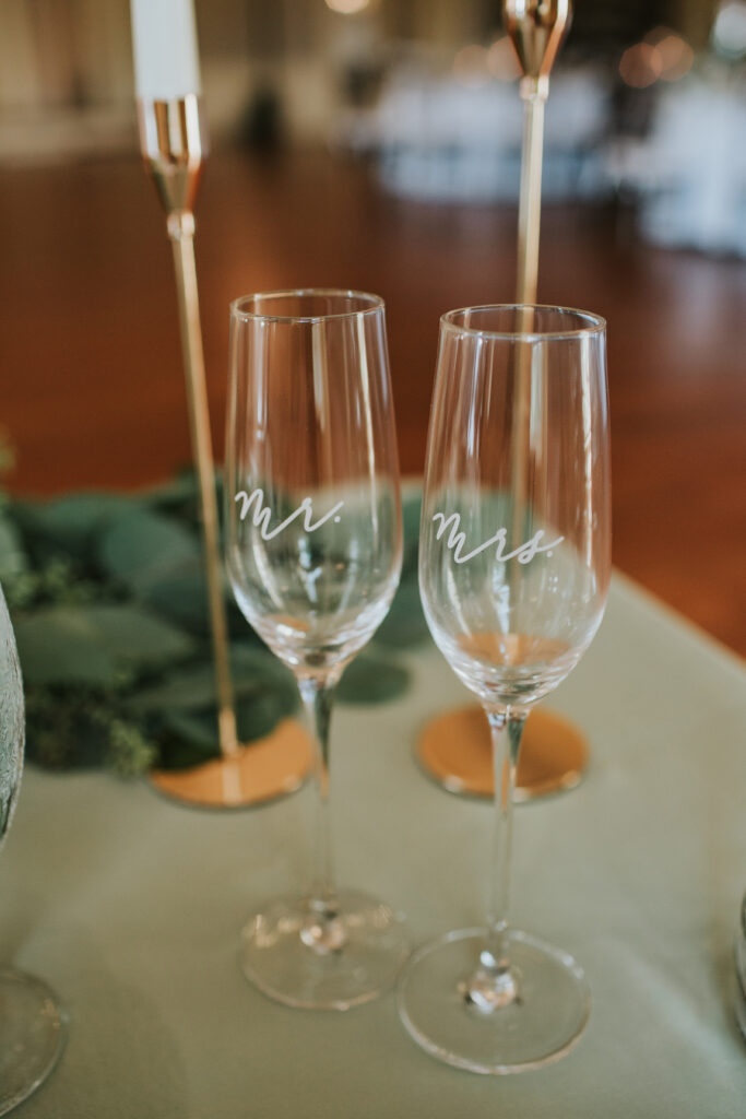 Close-up of Mr. and Mrs. champagne glasses, ready for a toast at Lovett Hall’s wedding reception.