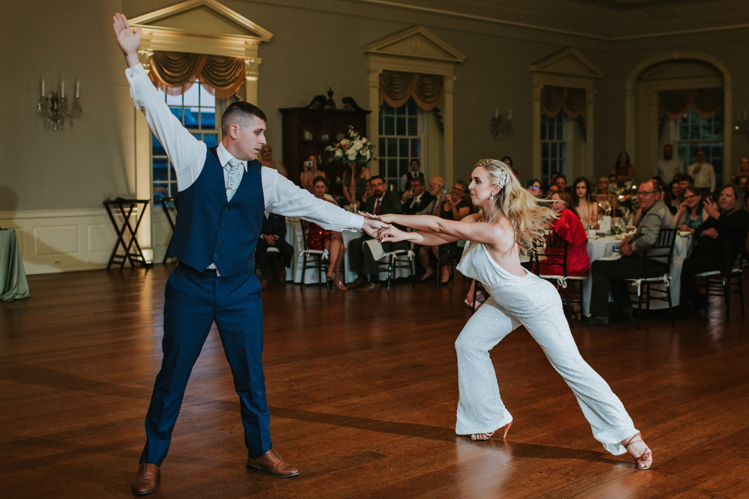 Newlyweds sharing their first dance at Lovett Hall, with romantic lighting and an elegant reception atmosphere.