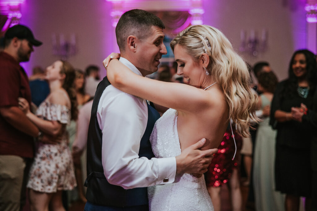 Romantic candid moment of the bride and groom smiling and enjoying their day at Lovett Hall.