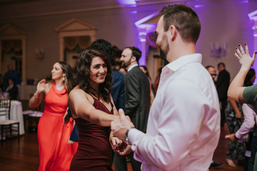 Lovett Hall illuminated at night, highlighting its elegant facade and creating a romantic atmosphere for a wedding celebration.