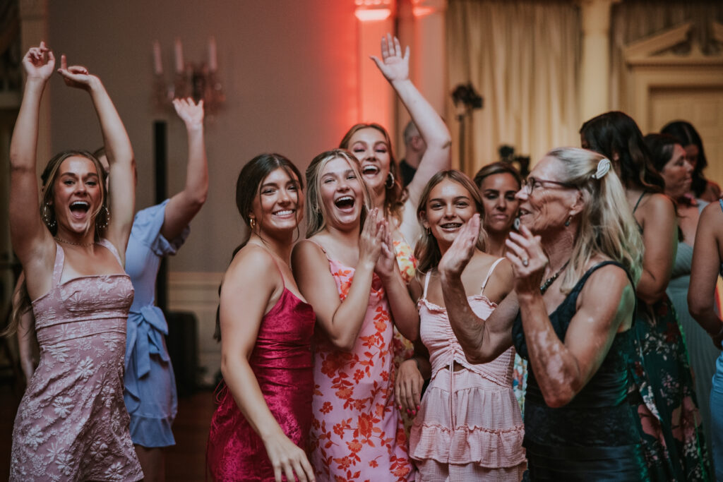 Guests enjoying the wedding reception at Lovett Hall, celebrating Amanda and Mitchell’s wedding day in a luxurious setting.