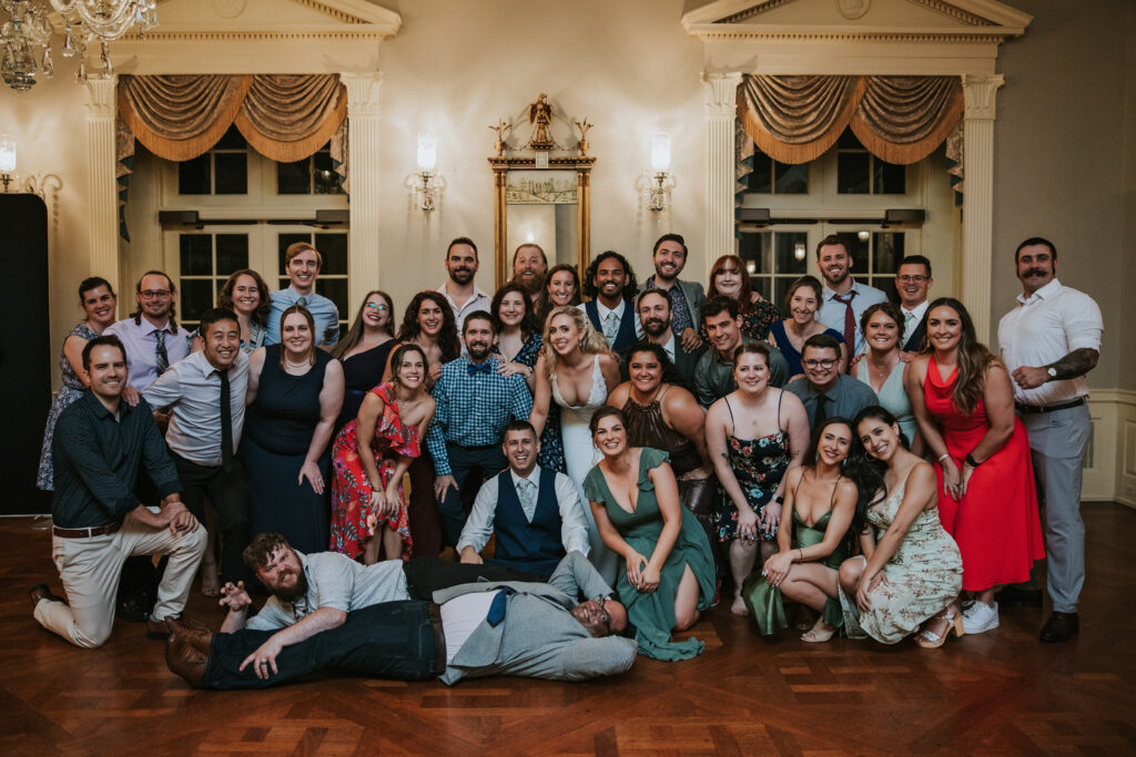 Newlyweds celebrating with family and friends at their reception at Lovett Hall, capturing a joyful wedding moment.