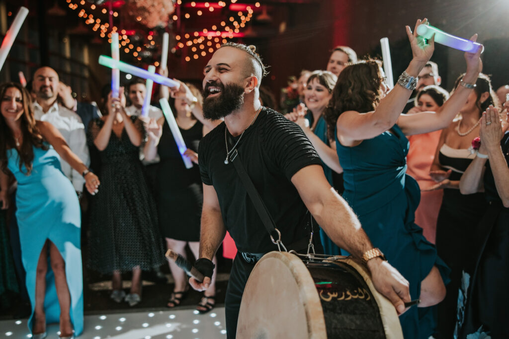 DJ plays traditional Chaldean drums as part of the dancing celebration at the Waterview Loft Detroit wedding.