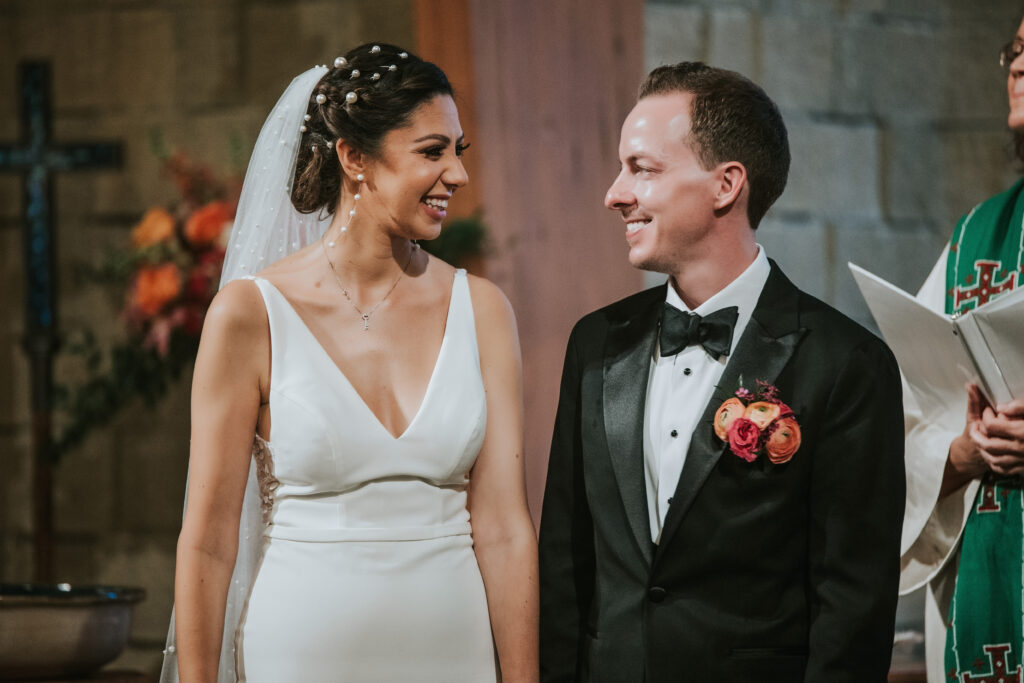 Bride and groom exchanging vows at Lutheran Church of the Master, Troy wedding ceremony.