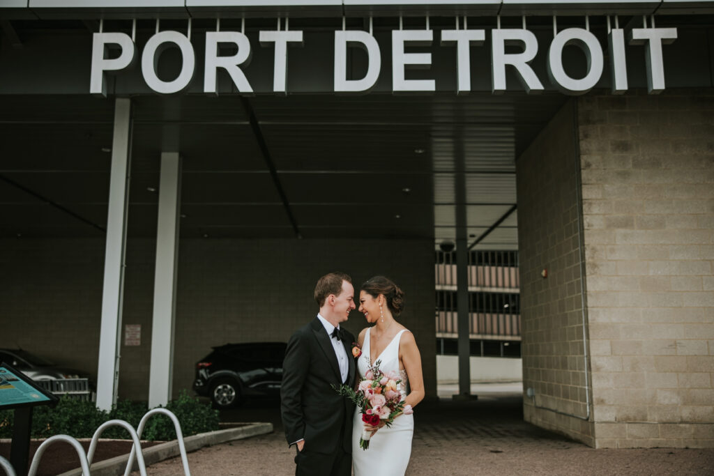 Bride and groom along the riverfront at Waterview Loft, Detroit wedding venue.