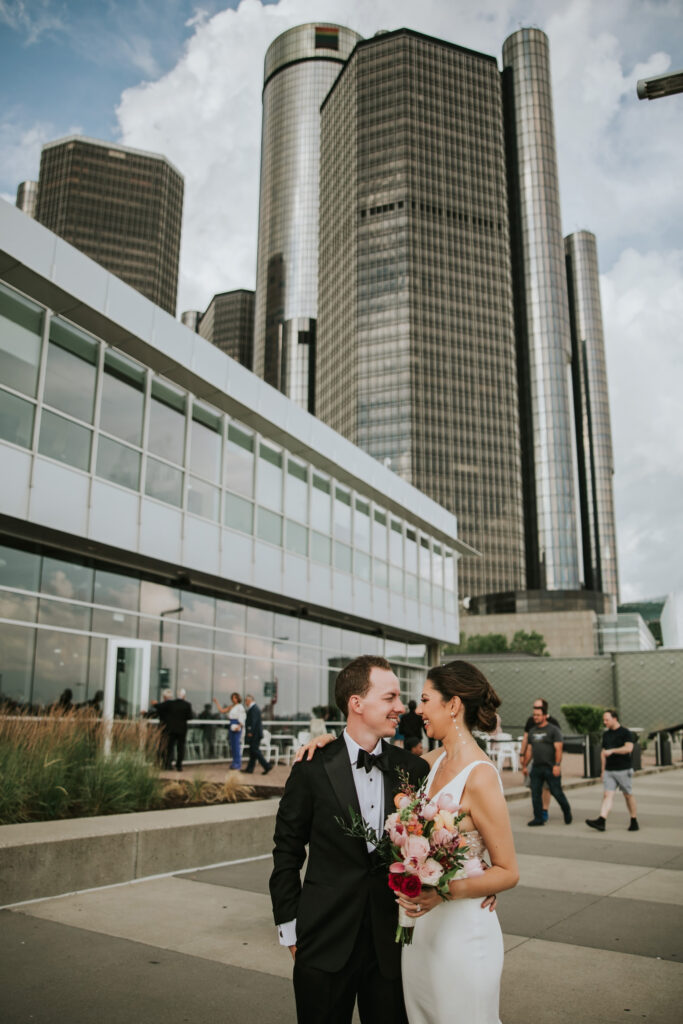 Bride and groom along the riverfront at Waterview Loft, Detroit wedding venue.