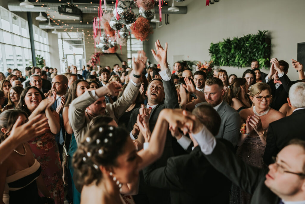 Lively dance floor at Waterview Loft, Detroit wedding venue.