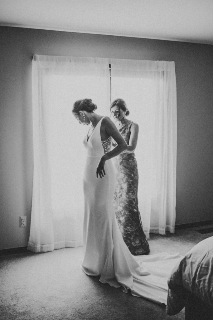 Bride getting ready in her dress at Waterview Loft, Detroit wedding venue.