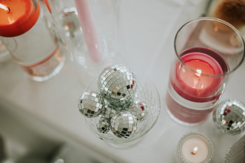 Vibrant wedding reception decor with disco balls at Waterview Loft, Detroit.