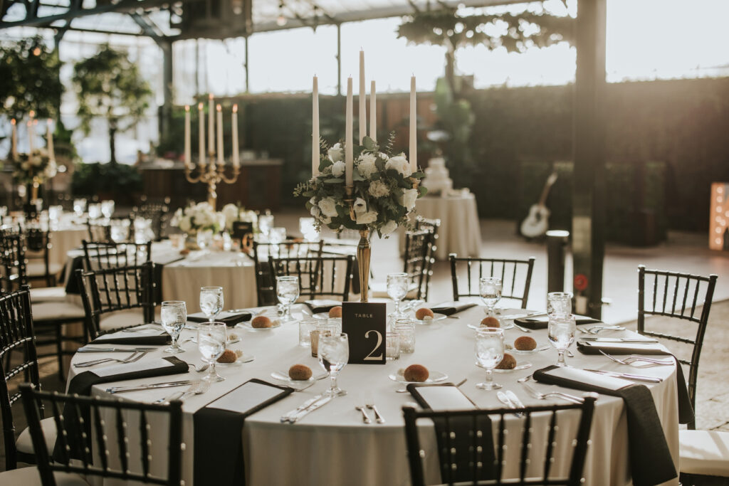 Elegant wedding venue with beautifully arranged tables and decor | Wedding Planning Tips - Planterra Conservatory