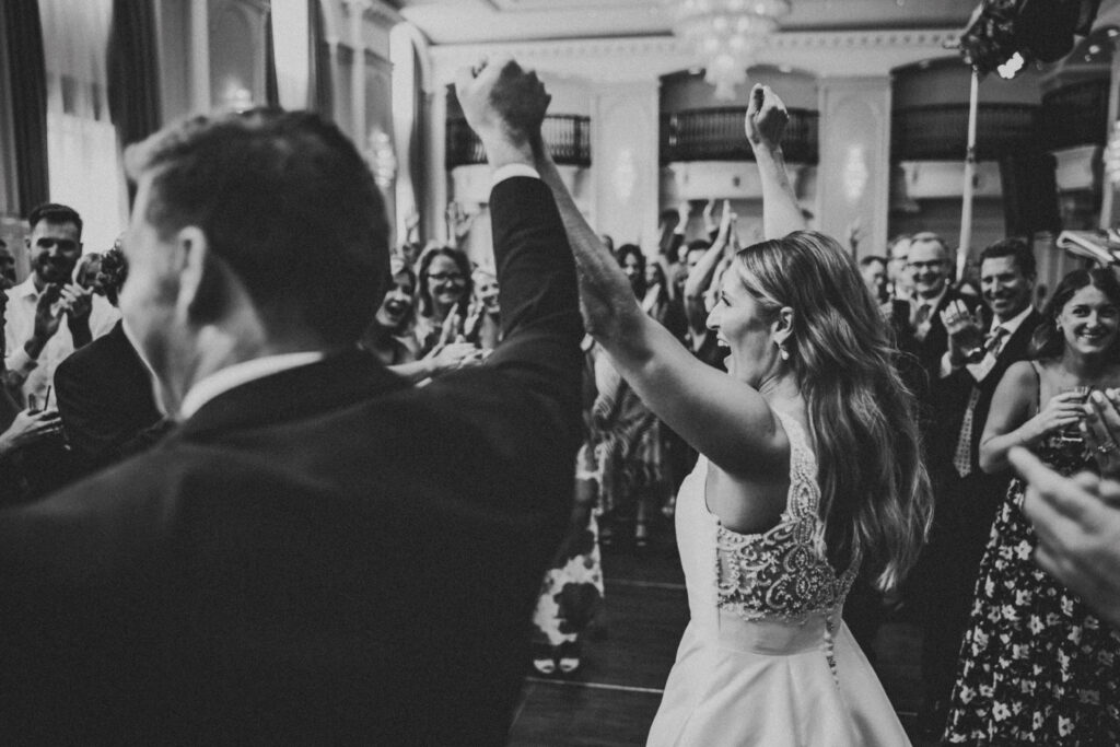 Bride and groom sharing a joyful moment during their Westin Book Cadillac wedding reception