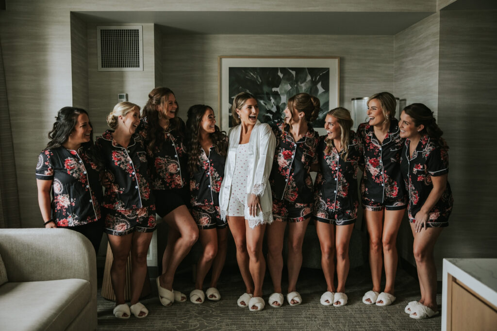 Bride laughing with bridesmaids before the ceremony at the Westin Book Cadillac