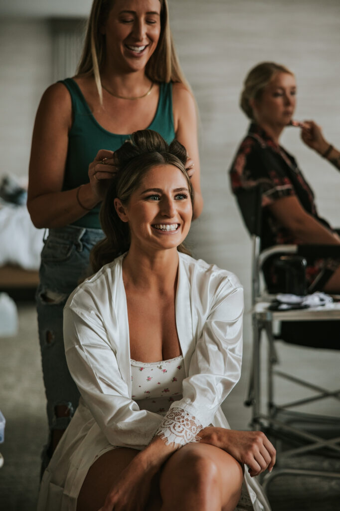 Bride has finishing hair touches for her Westin Book Cadillac wedding.