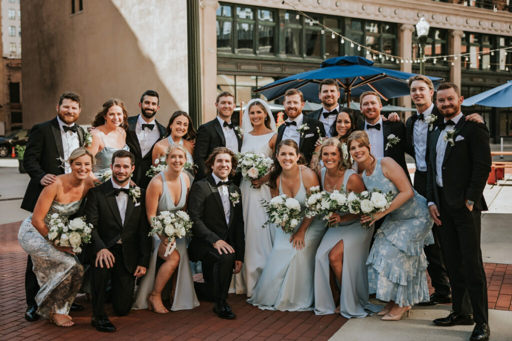 Wedding party posing for portraits at Capitol Park, Detroit, following the ceremony