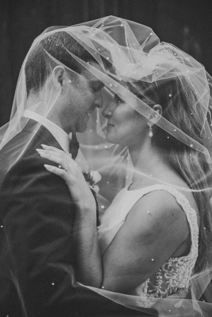 Bride and groom embracing during their Westin Book Cadillac wedding portraits in downtown Detroit