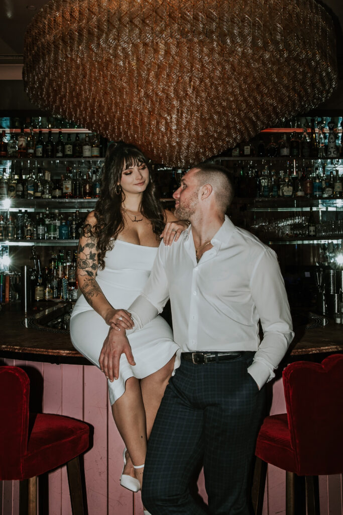 Elegant engagement portrait showcasing intimacy and charm at a Candy Bar Detroit Engagement session in a contemporary Detroit lounge.