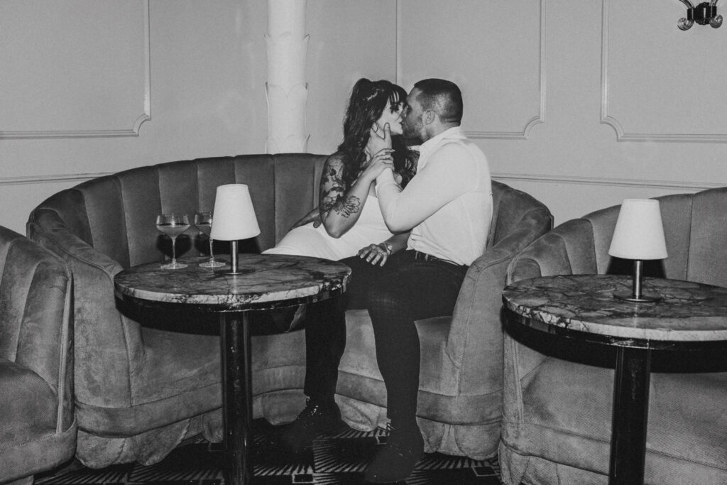 Tender kiss captured during a Candy Bar Detroit Engagement session at a stylish Detroit lounge