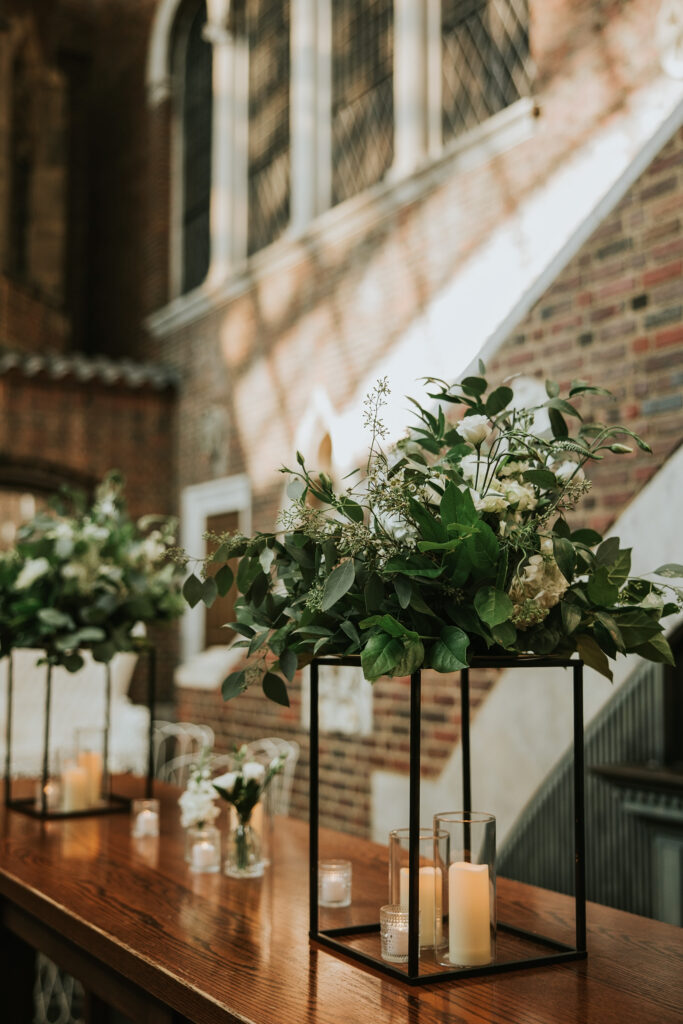 Table settings for the wedding reception at the Detroit Institute of Arts with elegant decor.