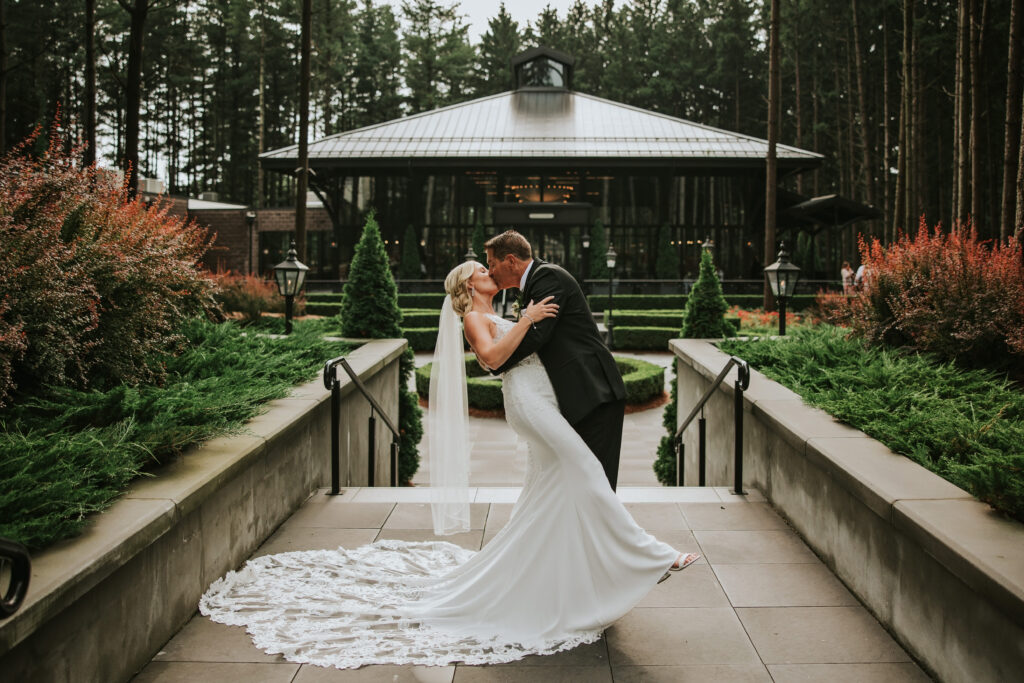 Groom dipping bride and kissing her | Shepherd's Hollow wedding photography