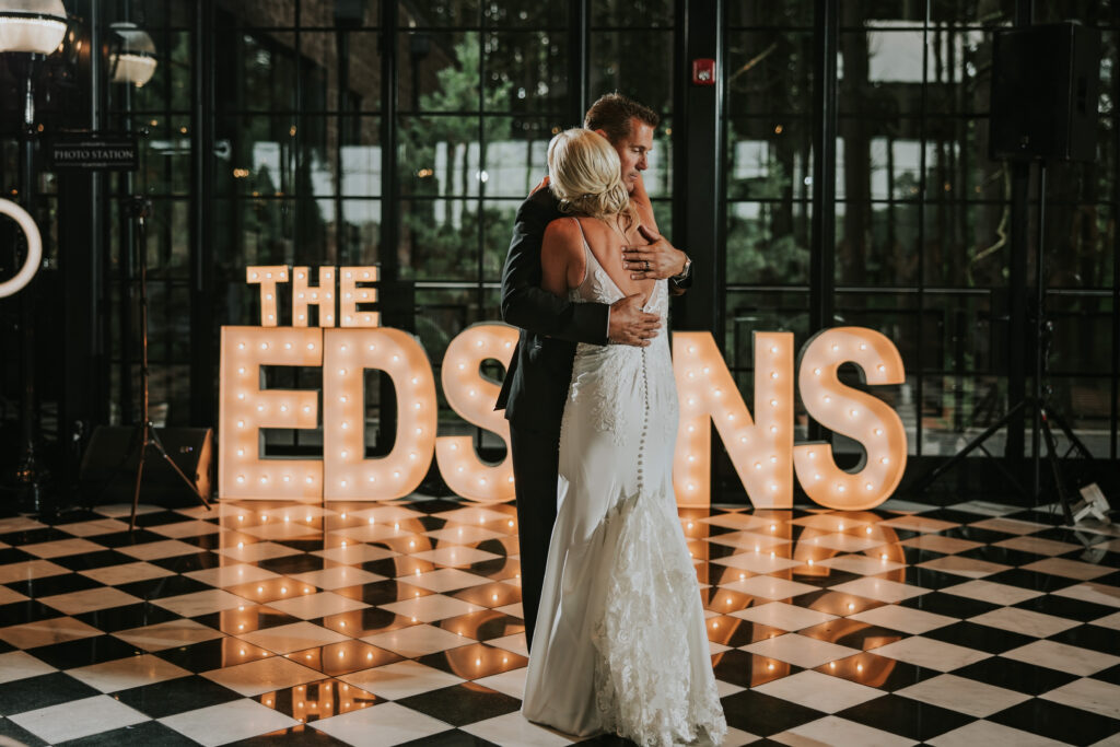 Bride and Groom hugging after their first dance at their Shepherd's Hollow wedding
