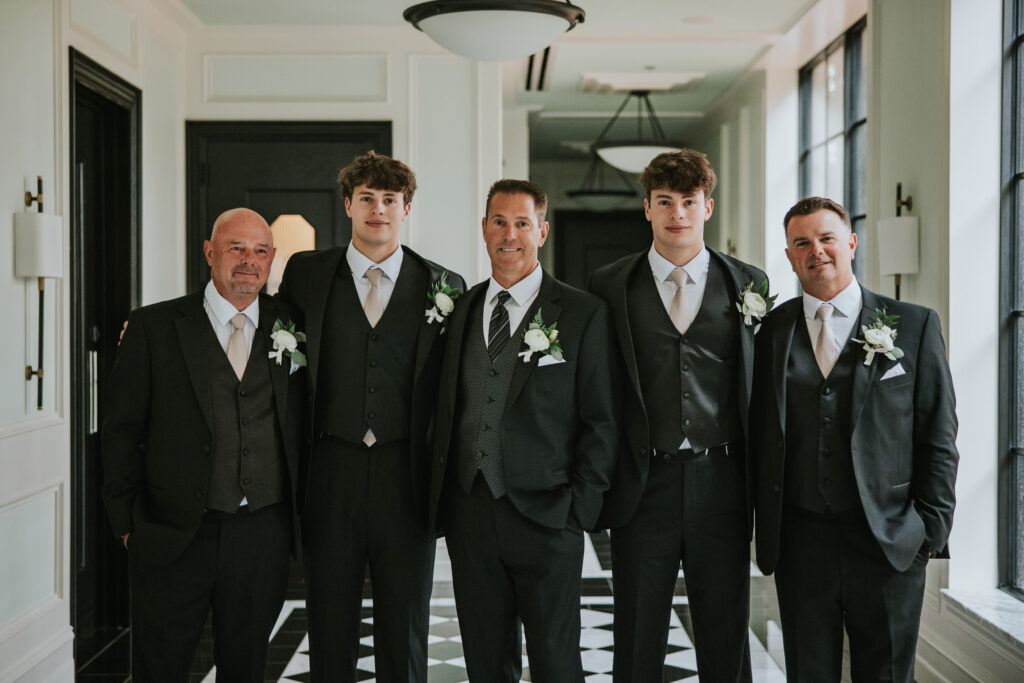 Groomsmen smiling for the camera at a Shepherd's Hollow wedding