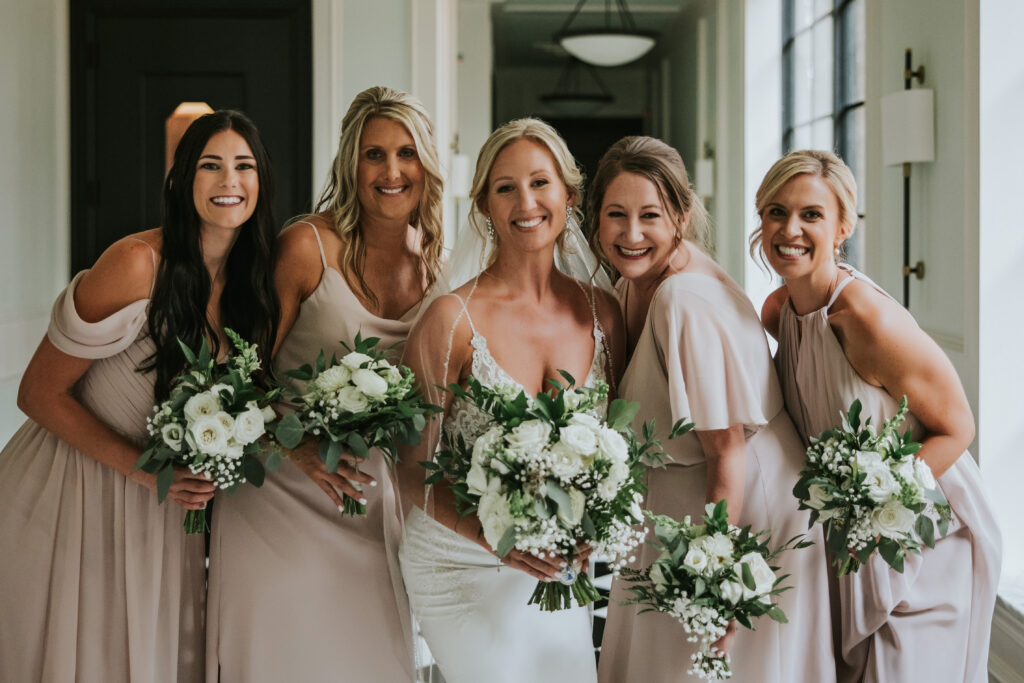 Close up of bridesmaids smiling at a Shepherd's Hollow wedding