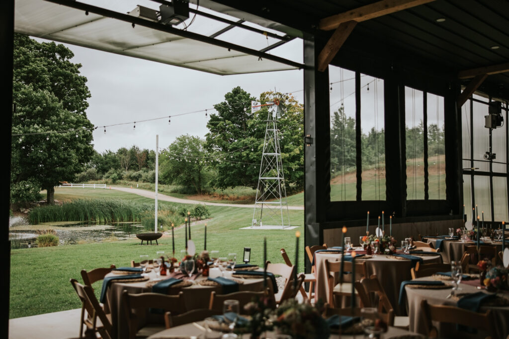 Rustic barn decorated with string lights for Traverse City wedding reception.