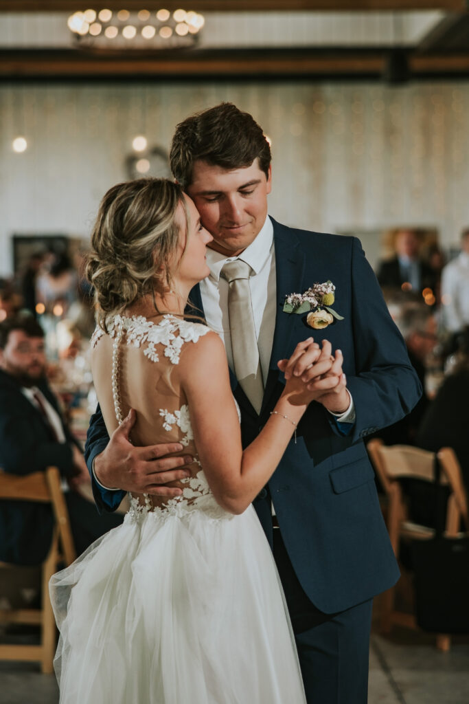 Bride and groom dancing their first dance at their Jacob's Farm Traverse City wedding