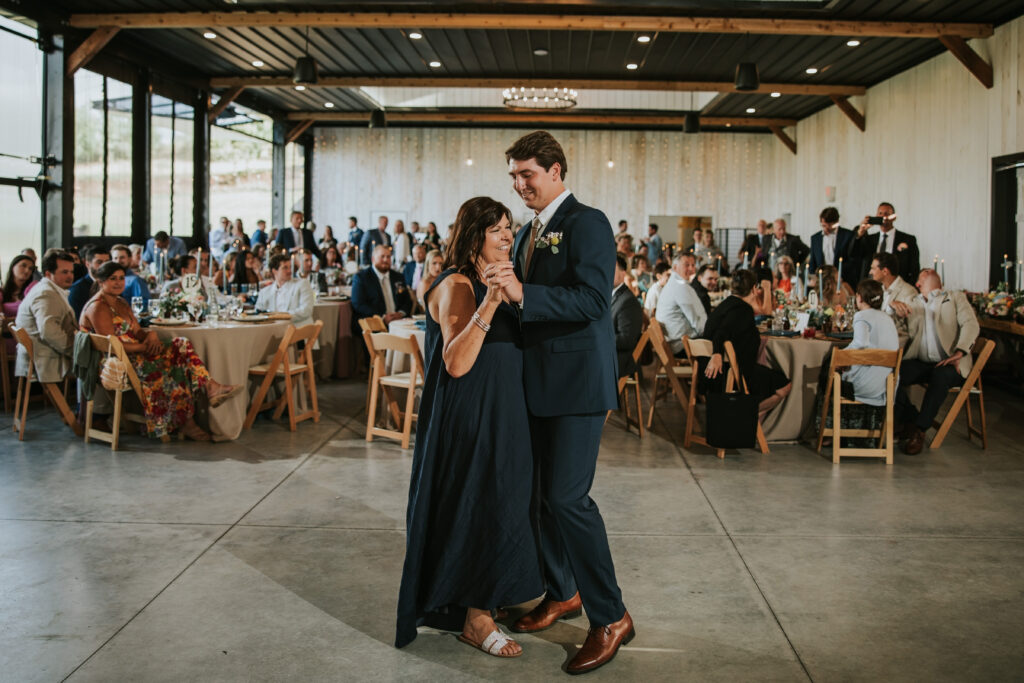 Groom dancing with his mom at his Jacob's Farm Traverse City wedding