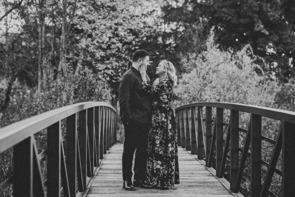 Bride and groom on bridge at their Kensington Metropark Engagement Session