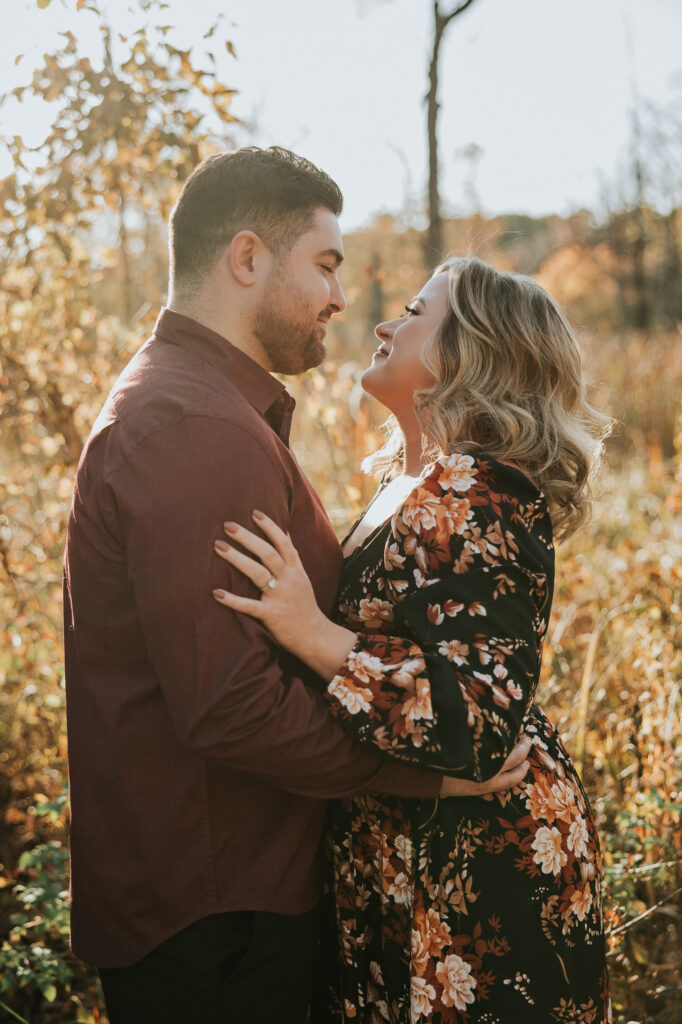 Bride and groom looking at each other at their Kensington Metropark Engagement Session